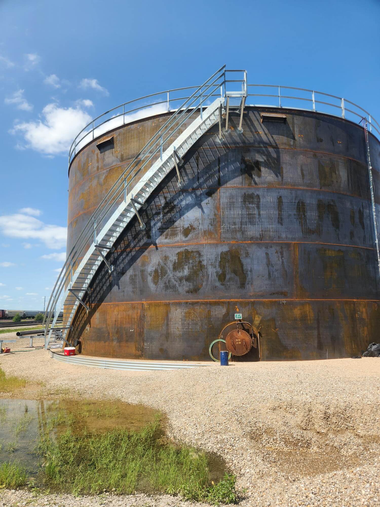 A newly constructed steel ethanol storage tank is seen prior to surface preparation.