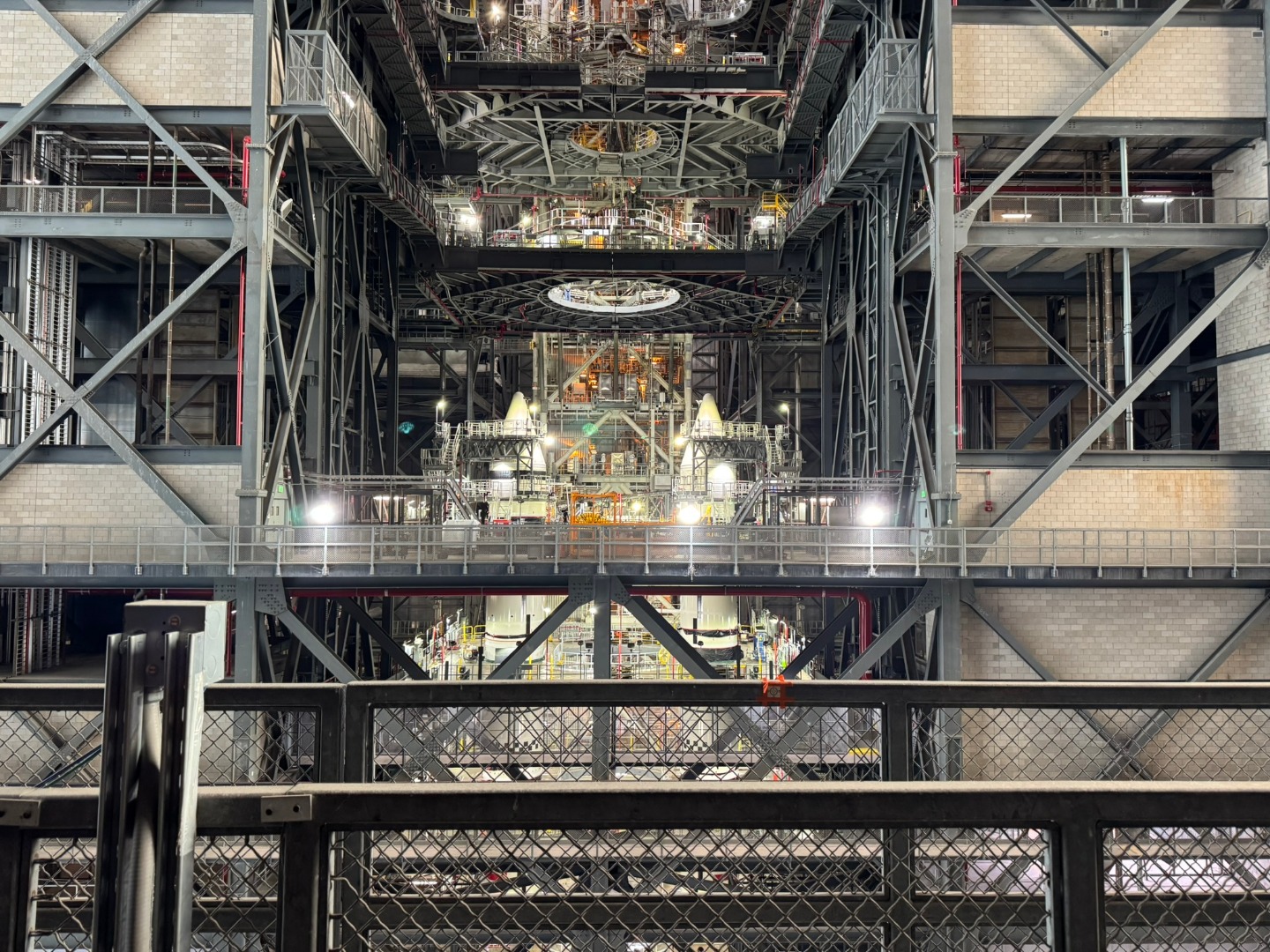 Gray structural steel columns, beams, and girders are shown inside the NASA Vertical Assembly Building.